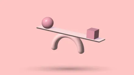 A 3D seesaw tipped out of balance, a sphere on the raised end and a cube on the lowered one